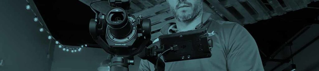 Videographer operating a DJI Ronin 4D camera-gimbal combo